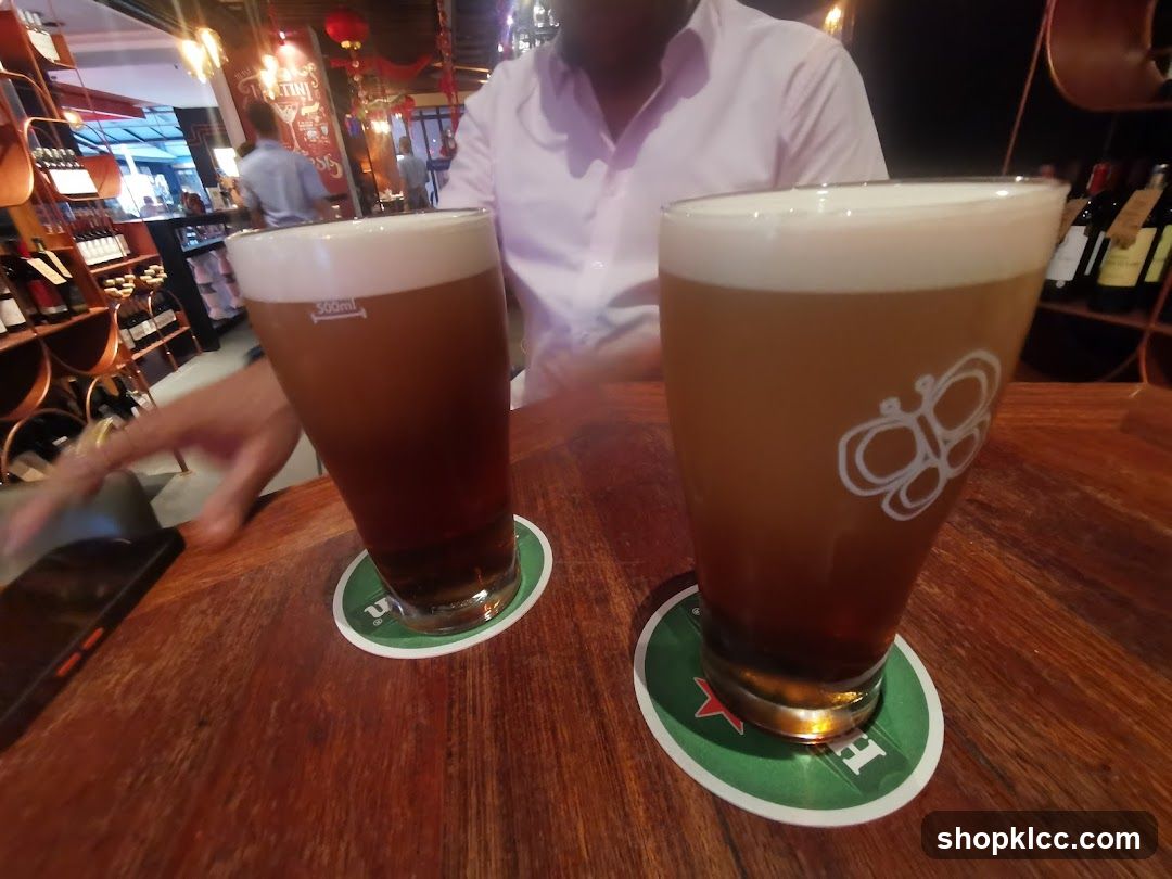 Two glasses of beer on a wooden table