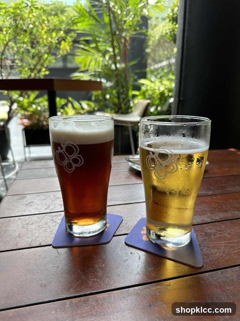 Two glasses of beer on a wooden table