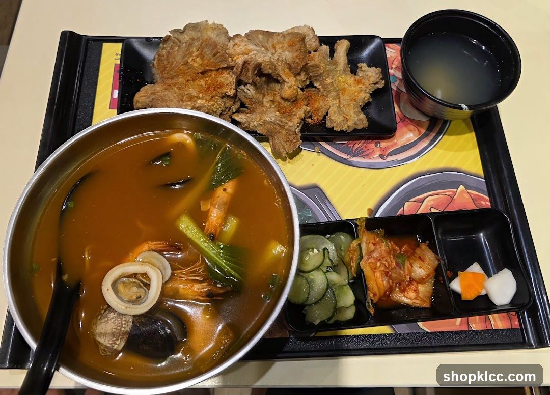 Seafood Noodle Soup with Fried Mushrooms and Side Dishes