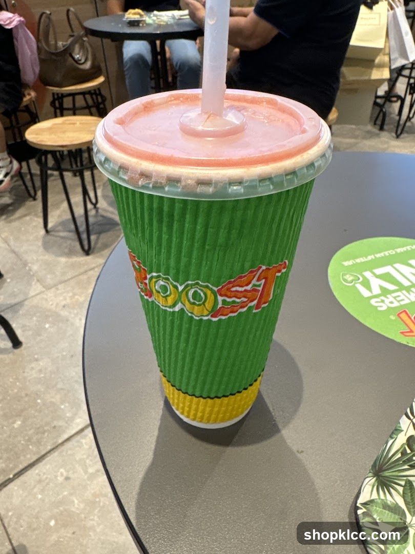 Green cup with a straw