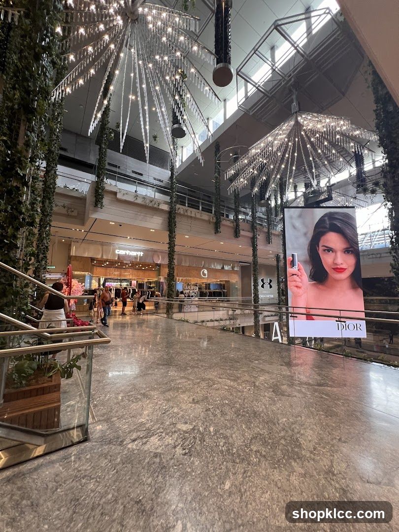 Indoor shopping mall with decorative lighting and advertising