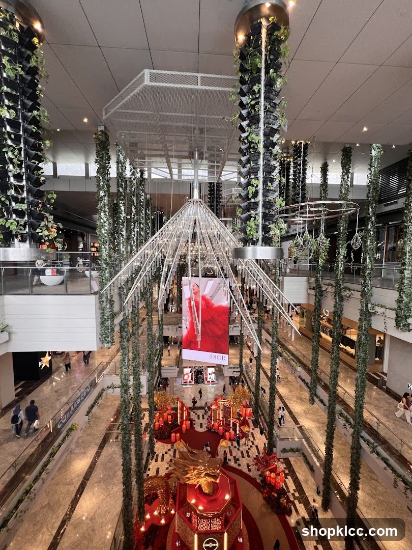 Indoor shopping mall with vertical gardens and festive decorations