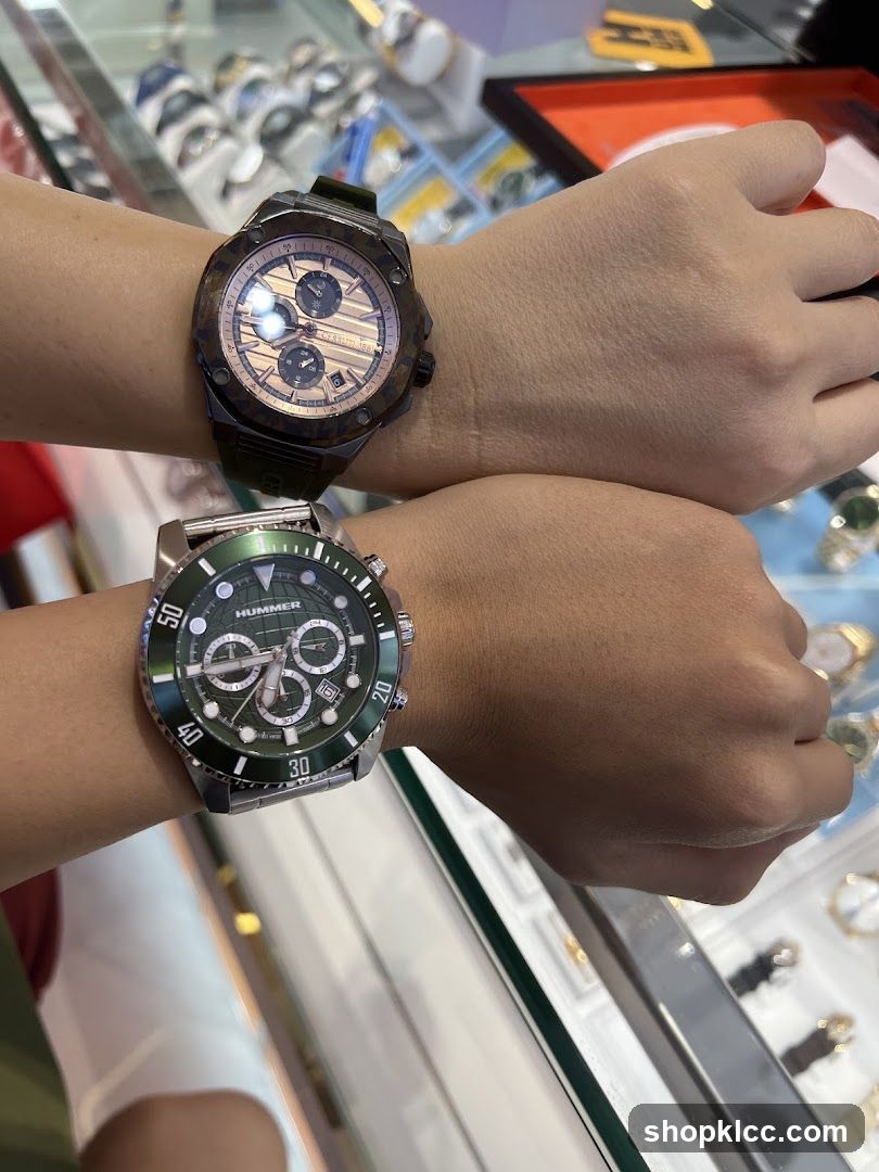 Two watches on wrists