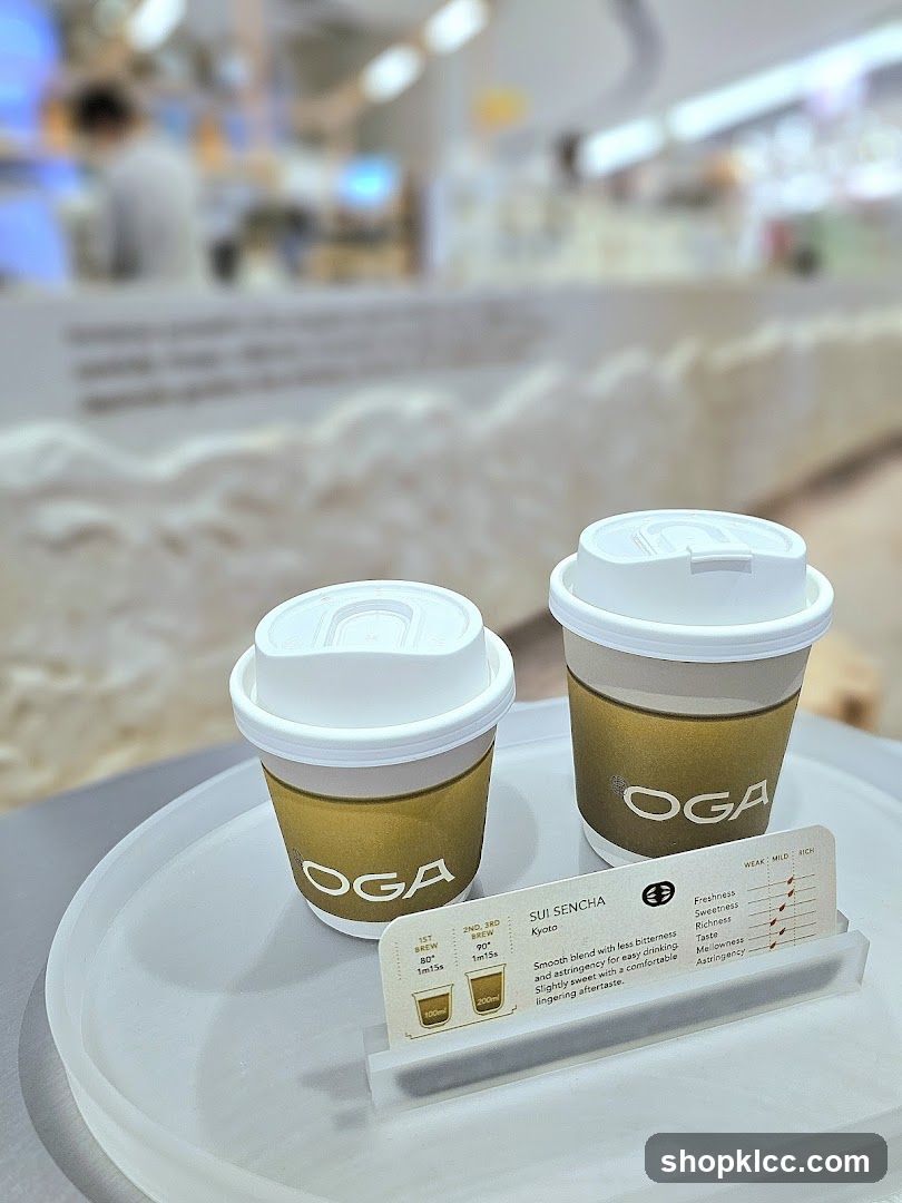 Two OGA Coffee Cups with Menu Card