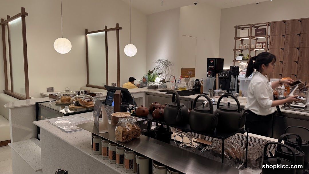 Cafe Interior with Staff and Teapots