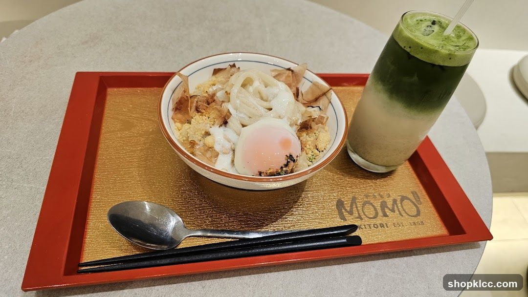 Udon noodles with egg and a matcha drink