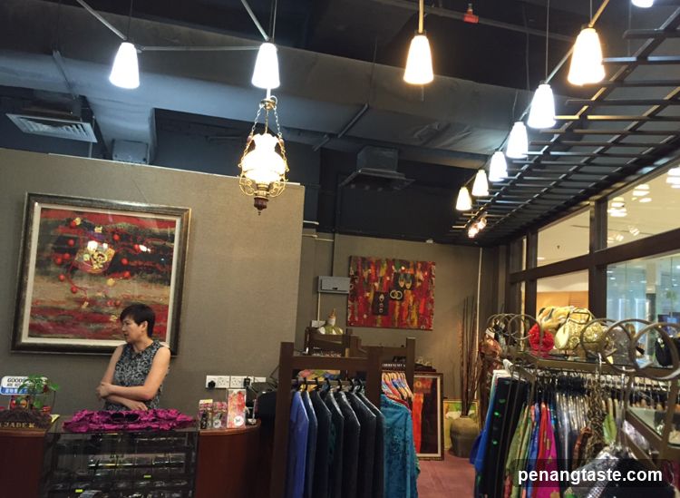Clothing store interior with artwork and clothing racks