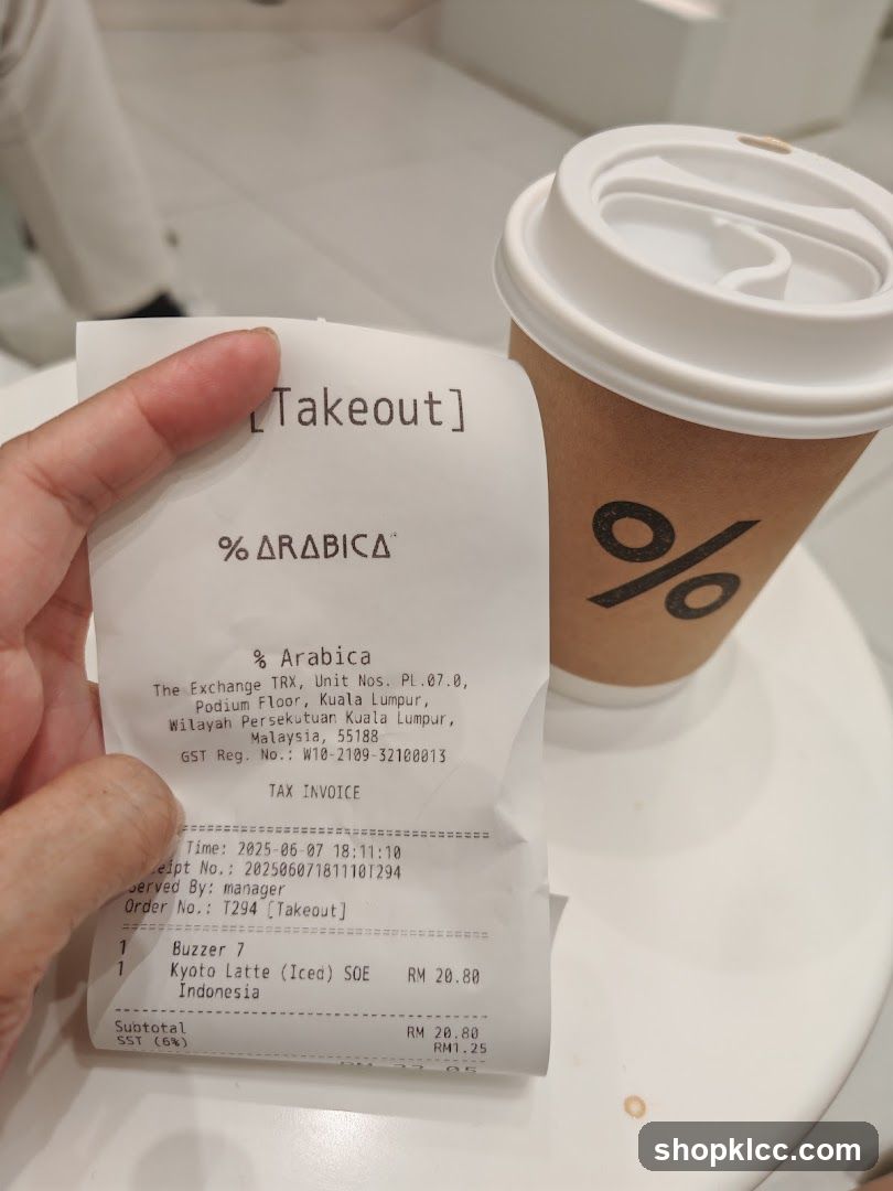 % Arabica Receipt and Coffee Cup