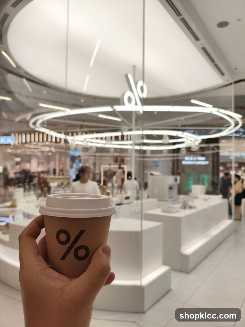Coffee cup with % logo