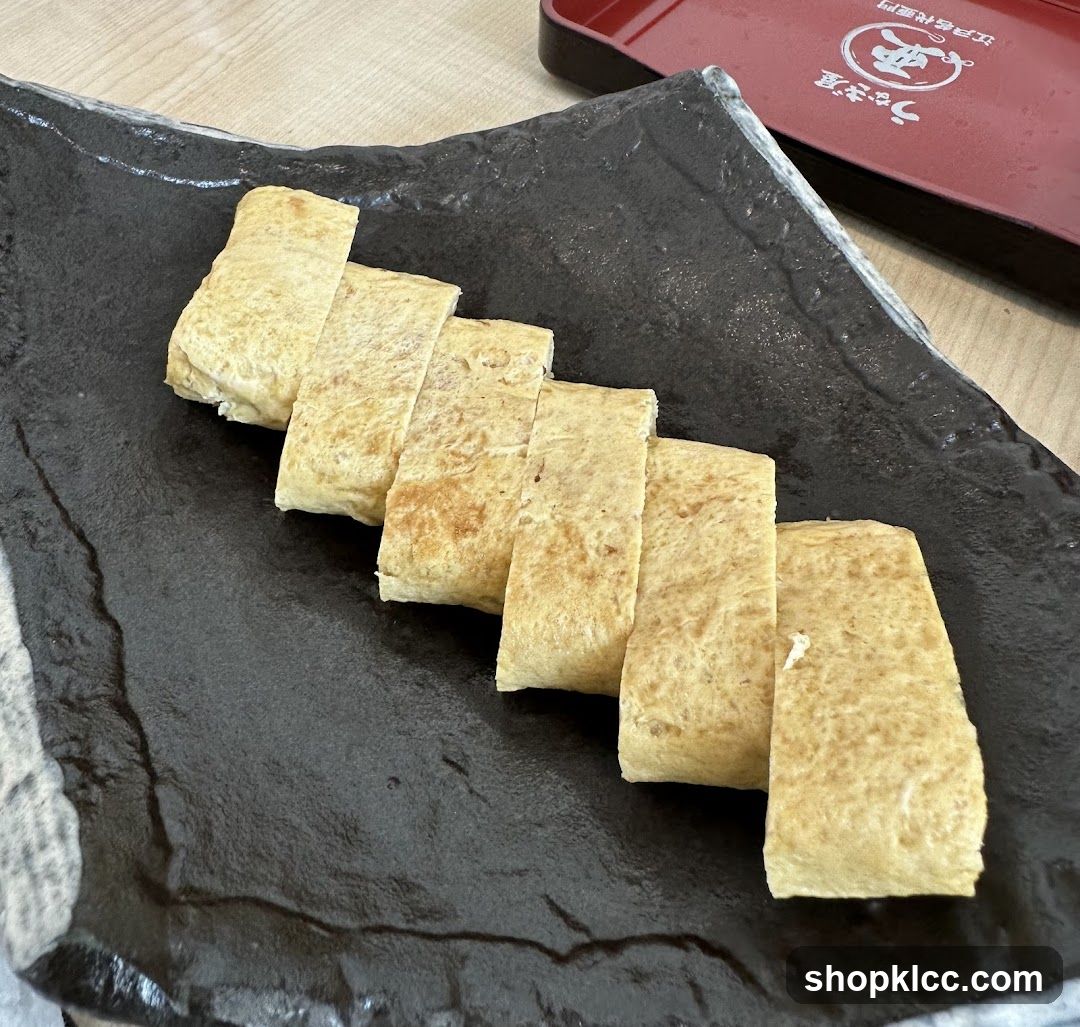 Tamagoyaki on a black plate