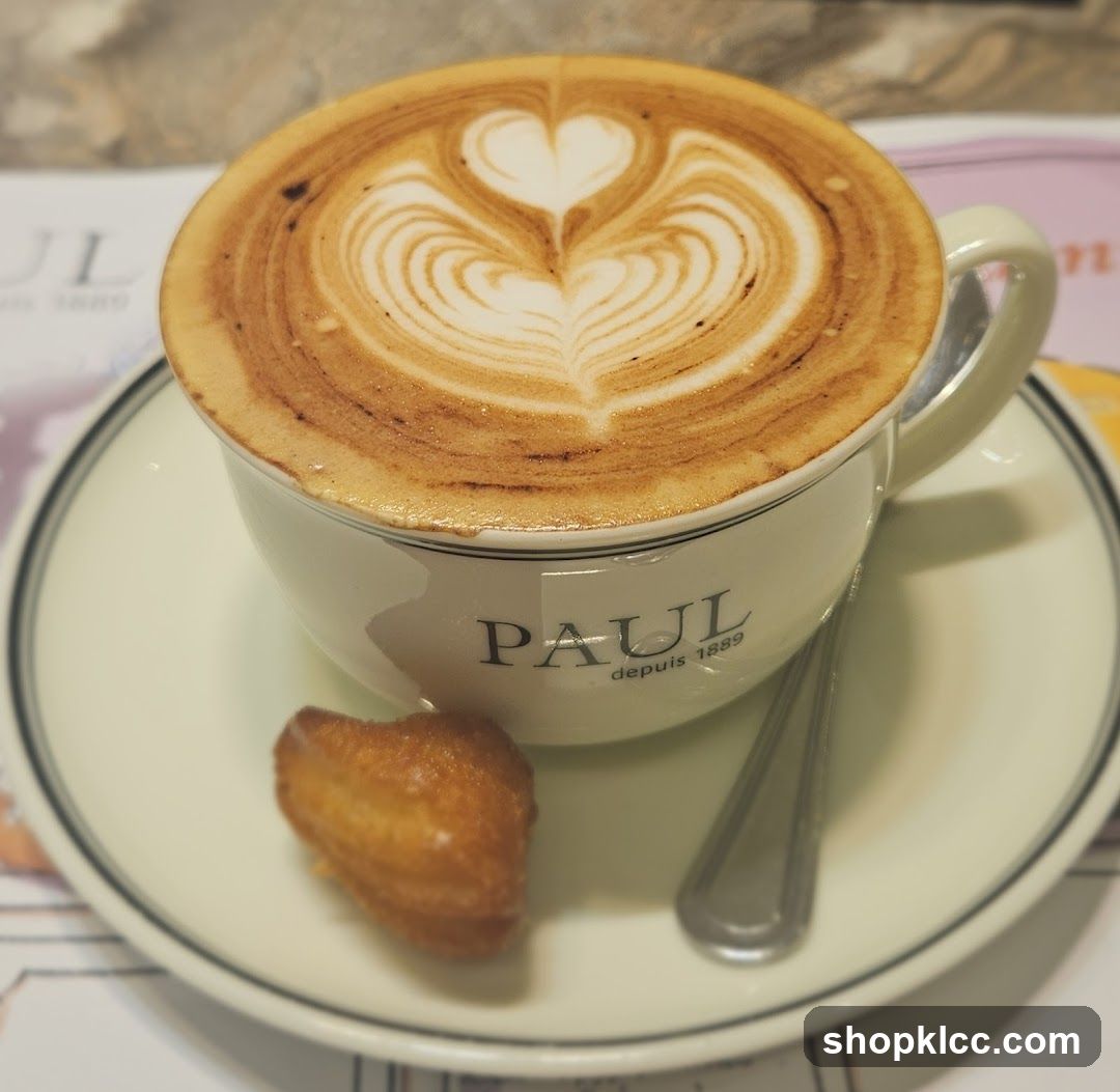 Cappuccino with Latte Art and a Madeleine