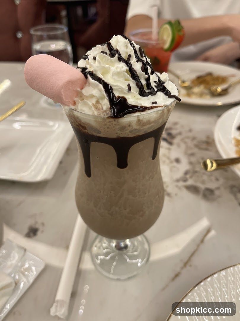 Chocolate milkshake with whipped cream and marshmallow