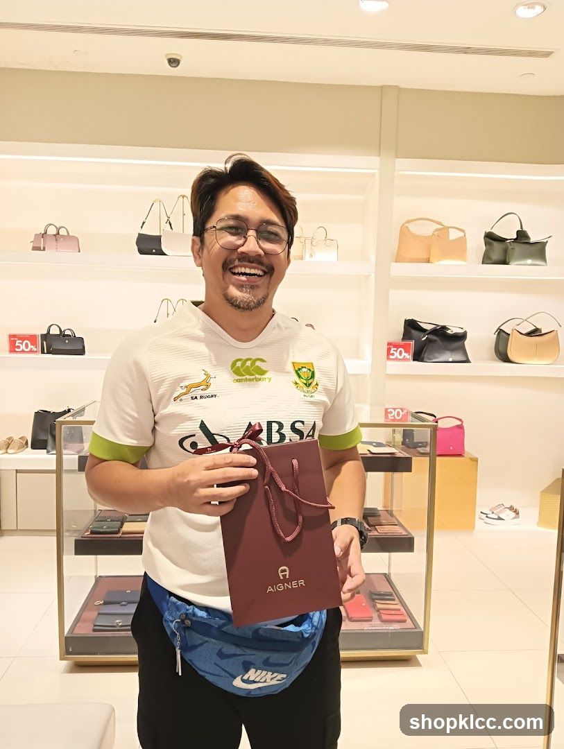 Man holding a shopping bag in a store