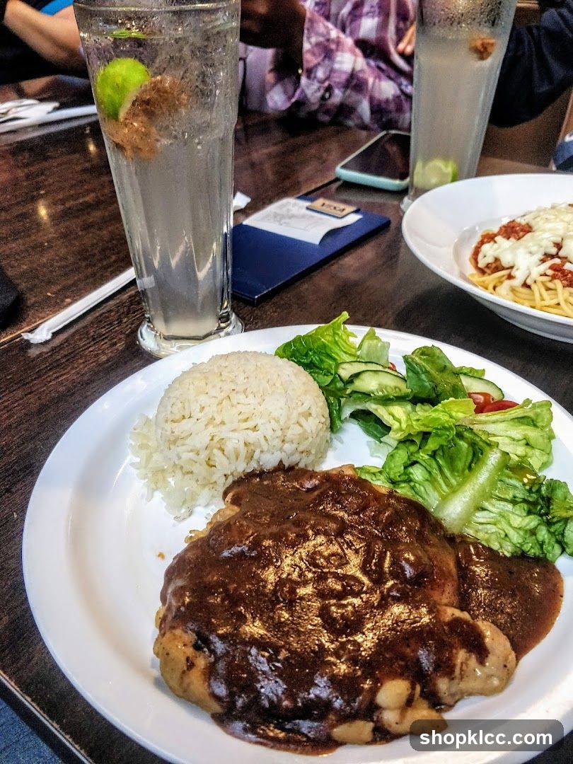 Chicken steak with rice and salad