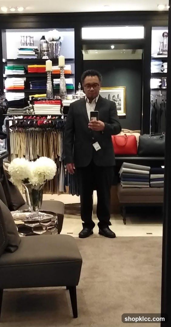 Man in Suit Trying on Clothes