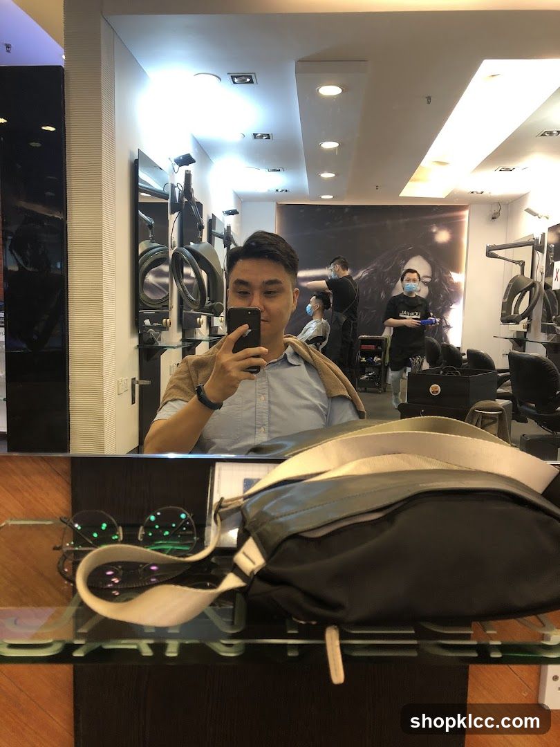 Man taking a selfie in a salon