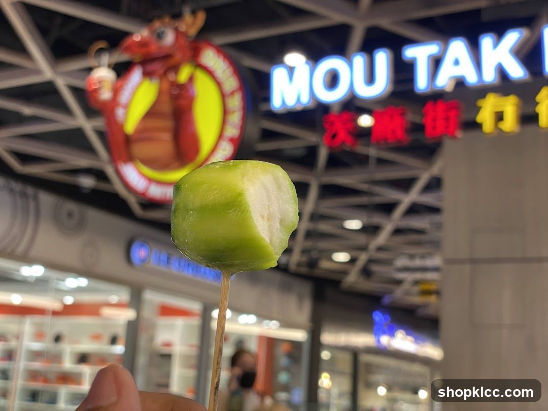 Fruit on a Stick with Storefront in Background