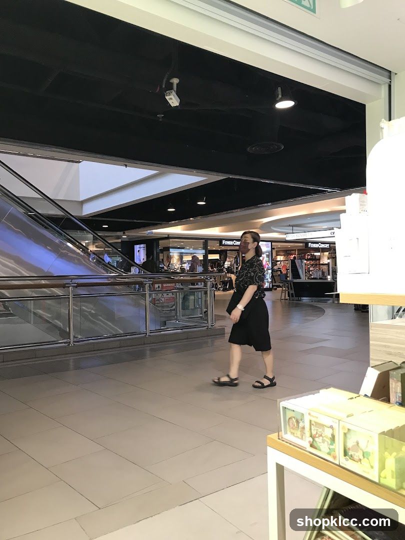 Mall Interior with Escalator and Shops