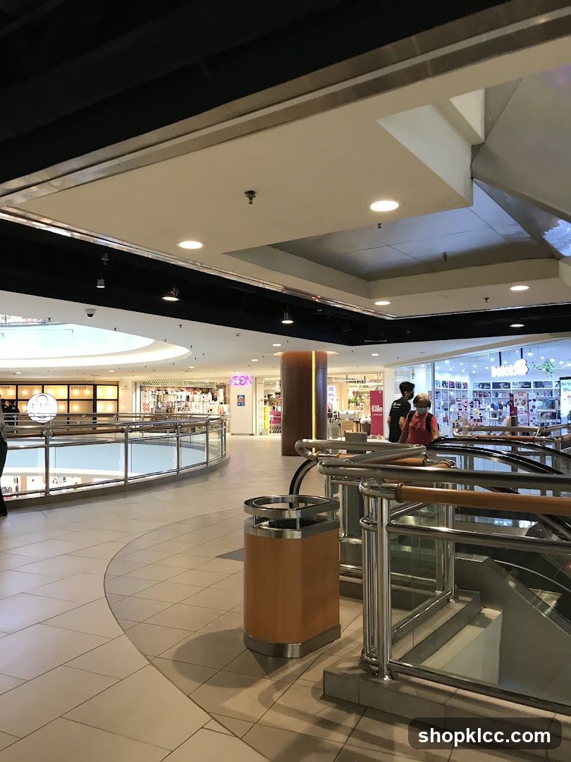 Mall Interior with Shops and Escalators