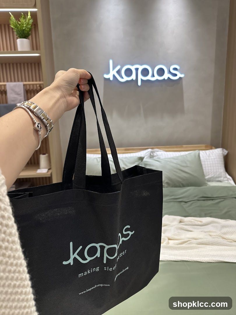 Kapas branded tote bag in a bedroom setting