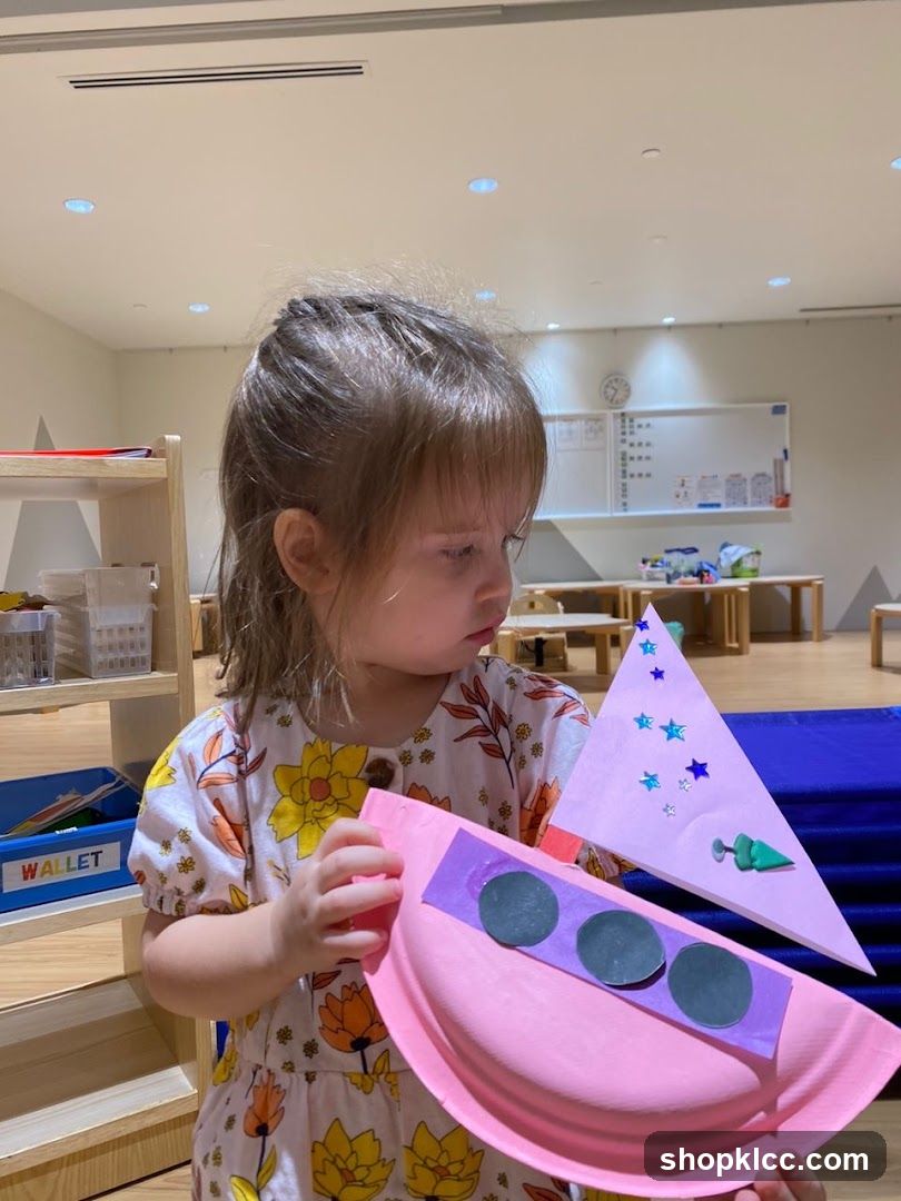 Child holding a craft project