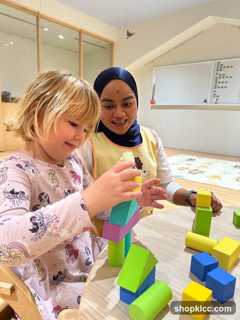 Child and caregiver playing with blocks