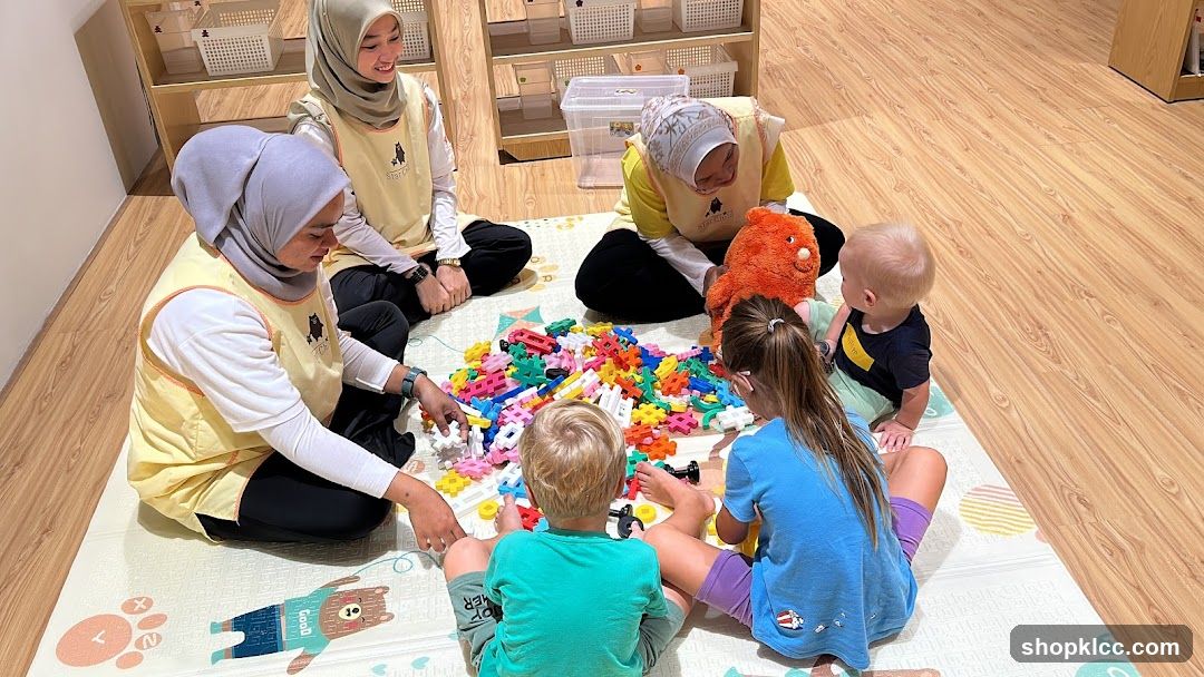 Children and teachers playing with blocks