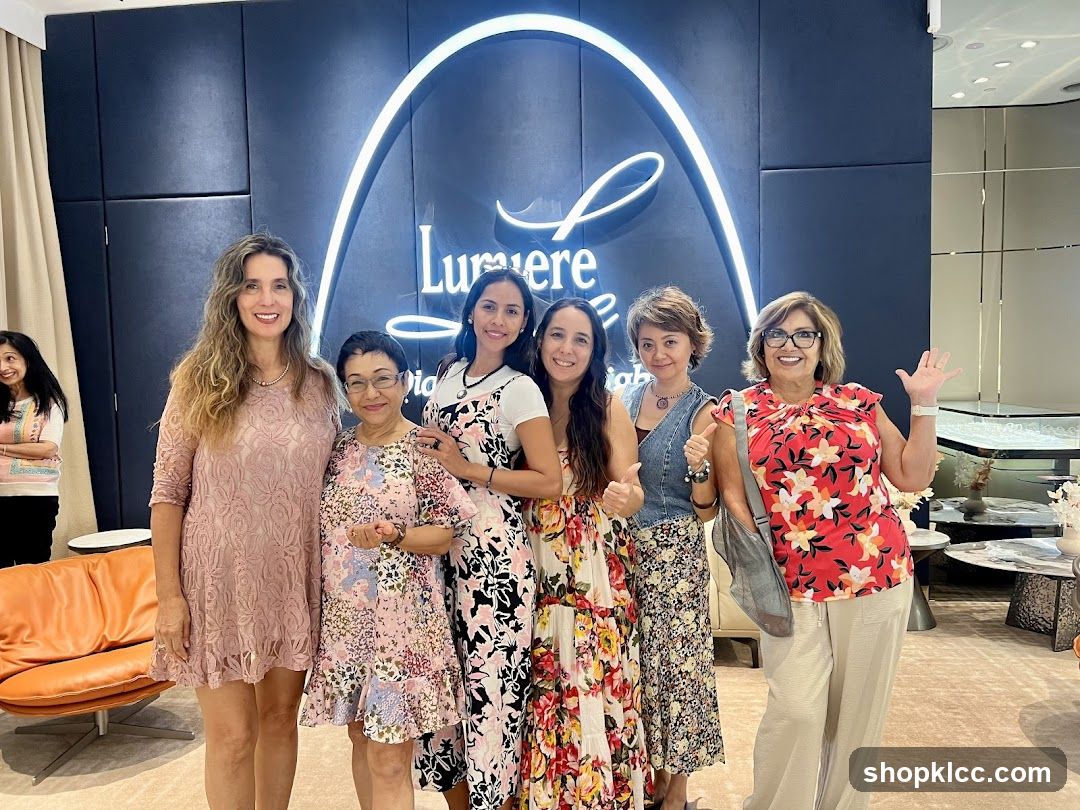 Group of women posing in front of a store logo