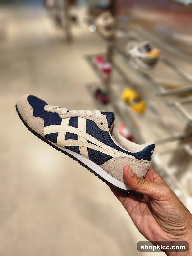 Hand holding a sneaker