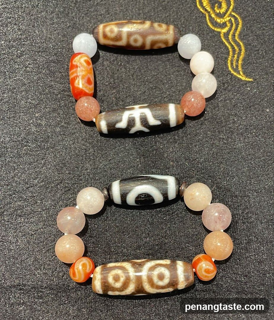 Two bracelets with dzi beads