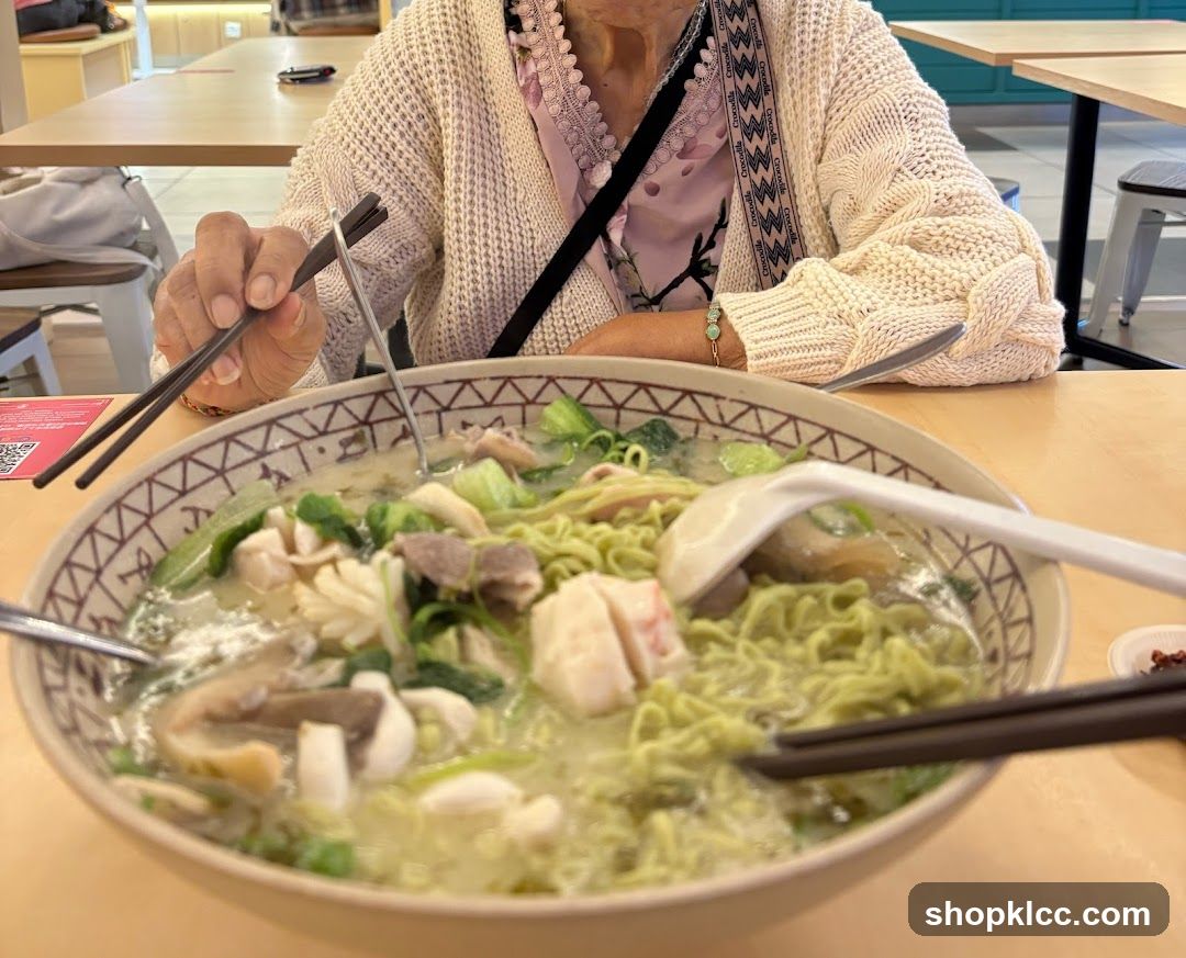 Person eating noodles