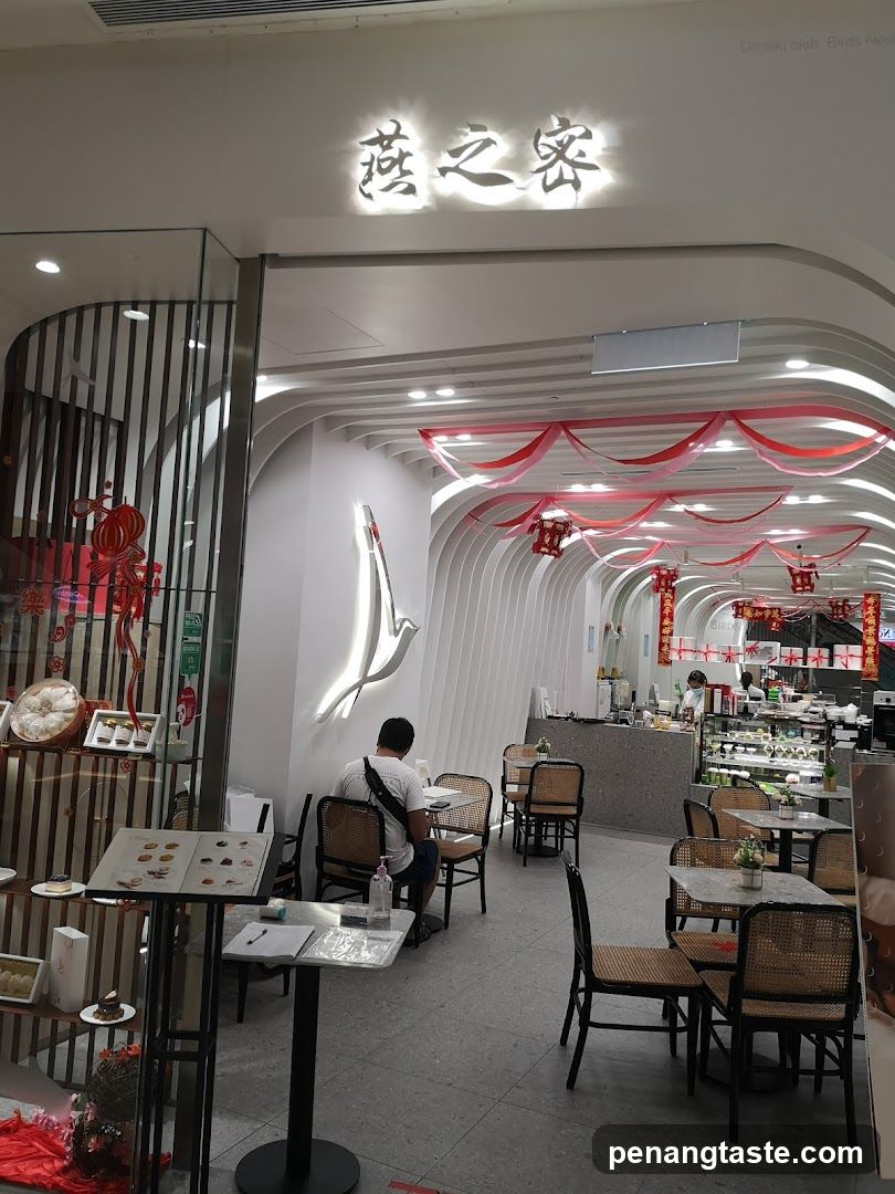 Interior of a cafe with seating and display cases