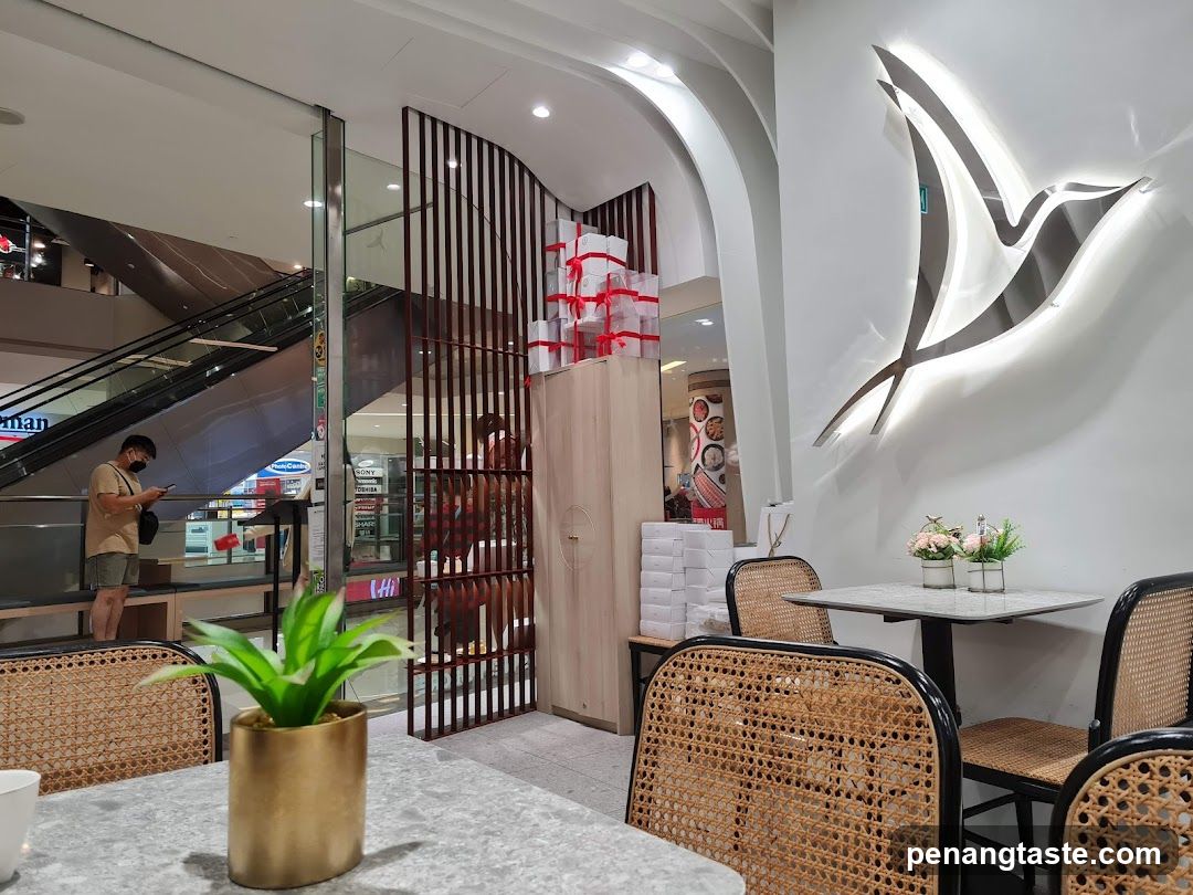 Interior of a cafe with a bird logo