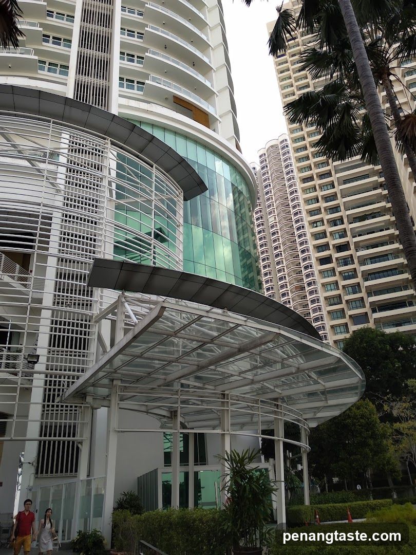 Modern Building Entrance with Palm Trees