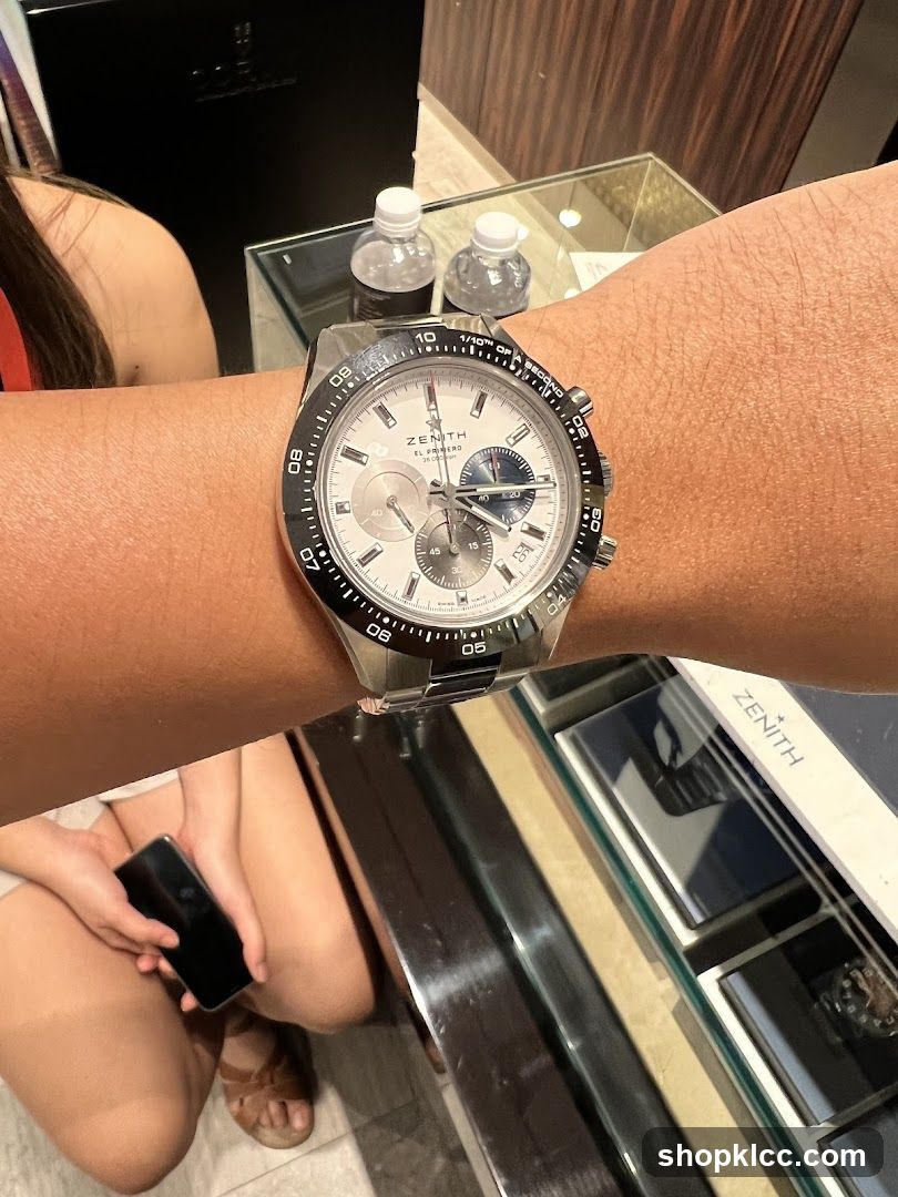 Person wearing a Zenith watch
