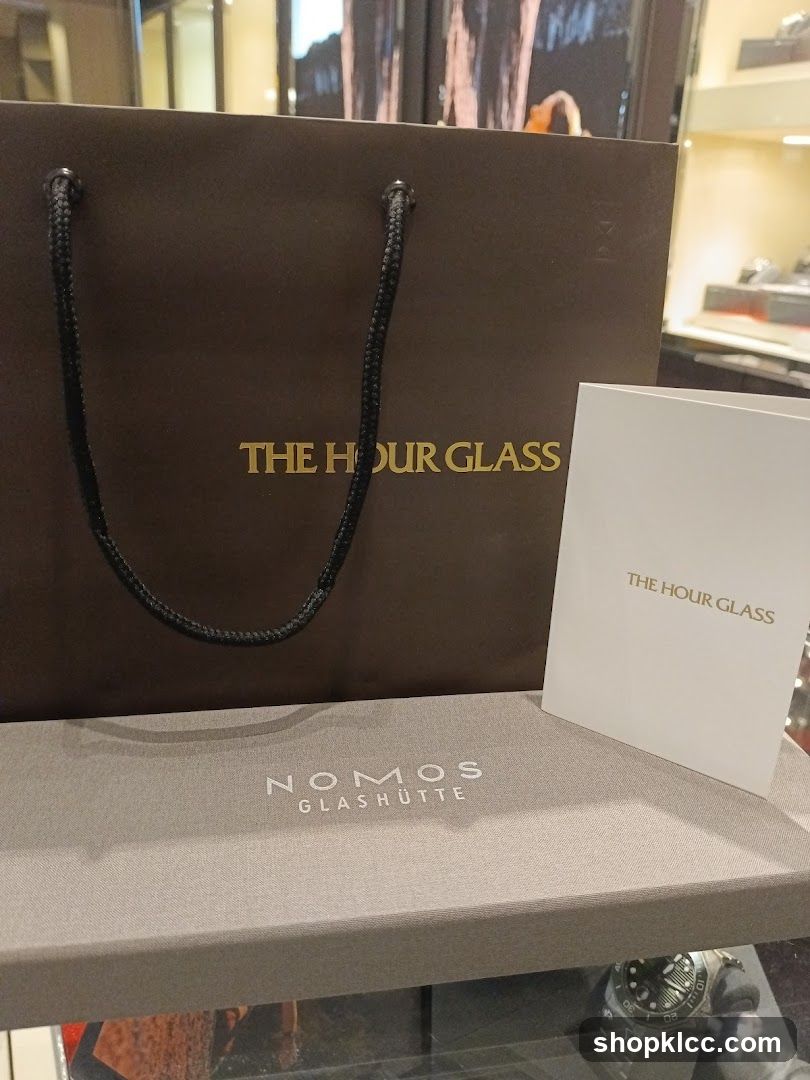 The Hour Glass and Nomos Glashütte branded items