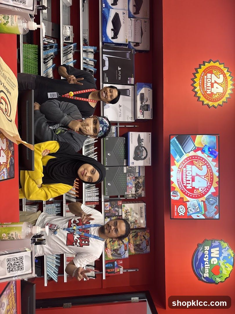 Employees Posing in Electronics Store