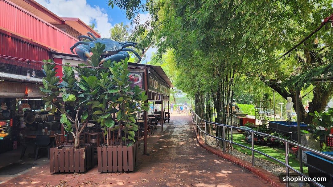 Outdoor dining area with crab sculpture
