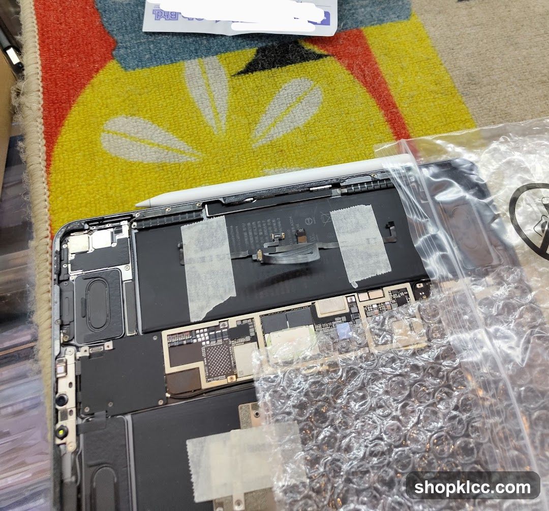 Disassembled Laptop on Carpet
