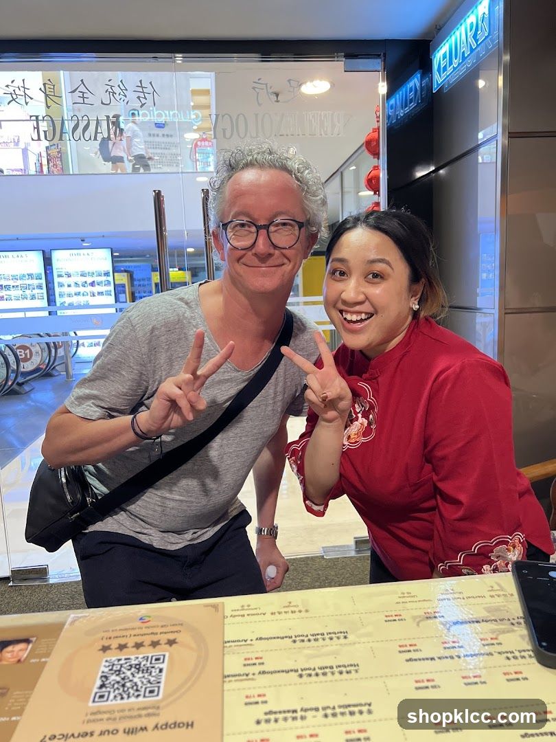 Two People Posing for a Photo in Front of a Massage Establishment