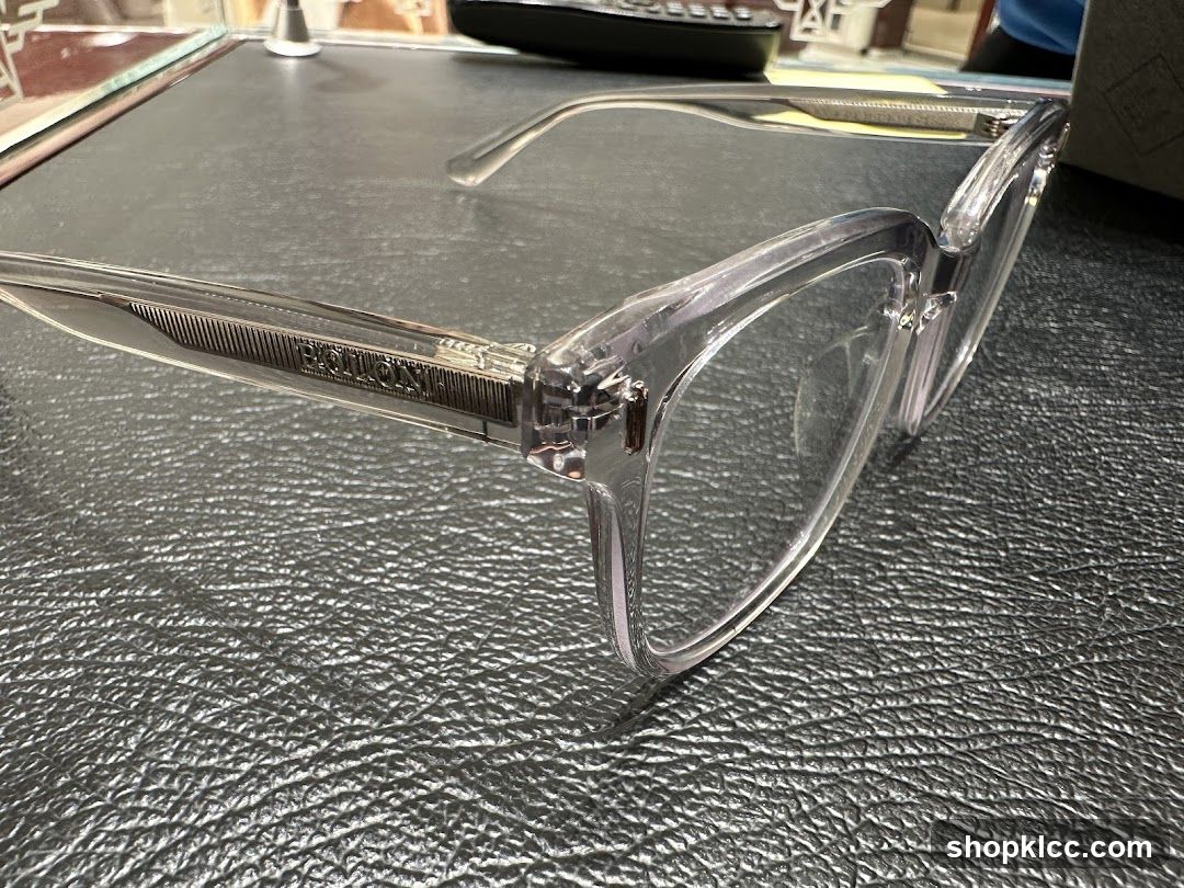 Clear Eyeglasses on Leather Surface