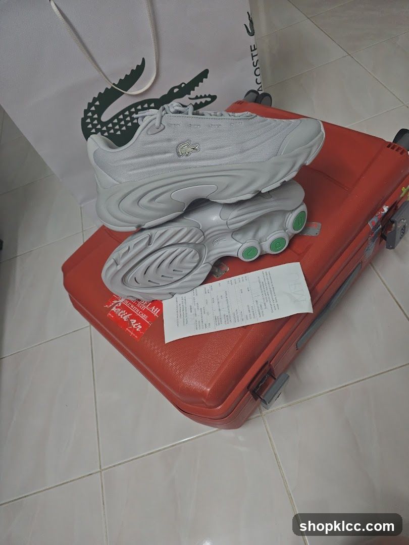 Lacoste Sneakers on Suitcase