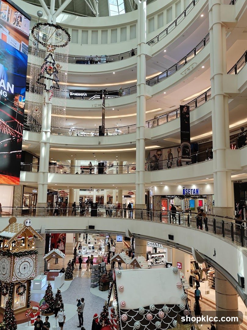 Multi-level shopping mall interior with Christmas decorations