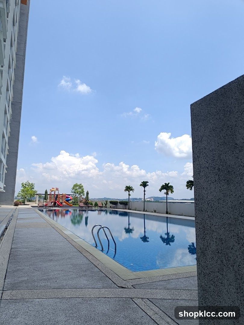 Outdoor Pool Area with Skyline View