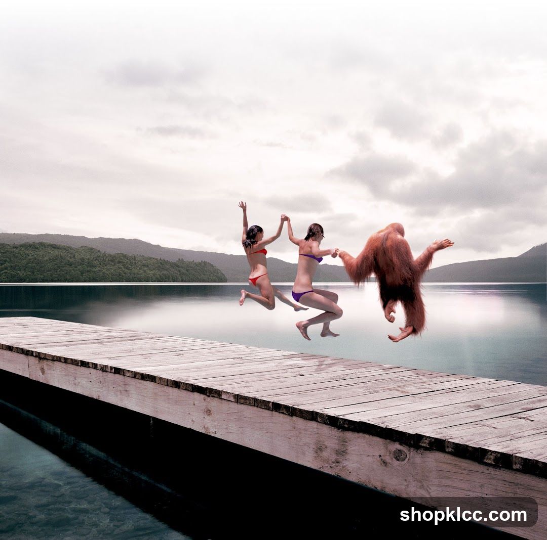 People Jumping Off a Dock with an Orangutan