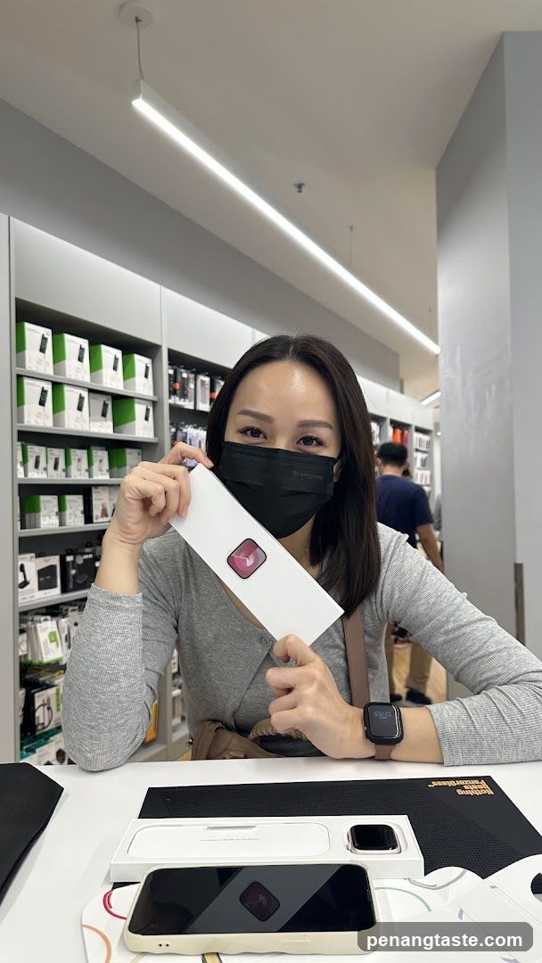 Woman holding a box with a watch