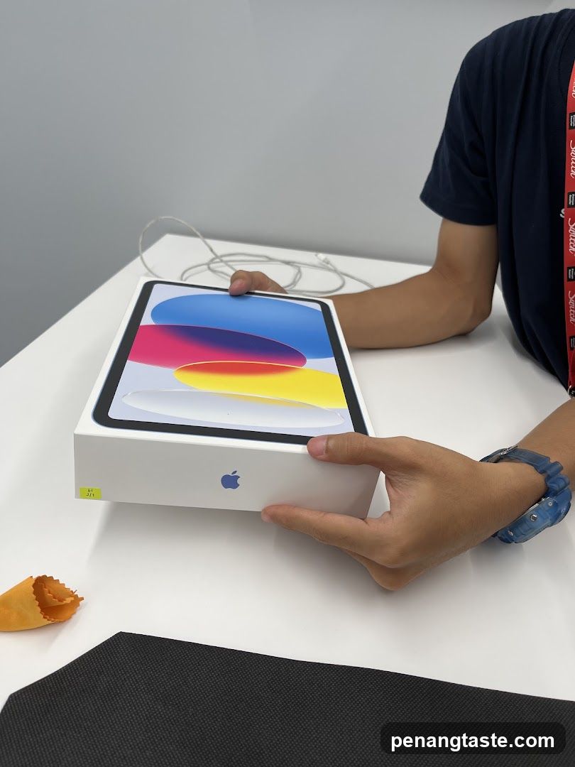 Person holding an iPad box