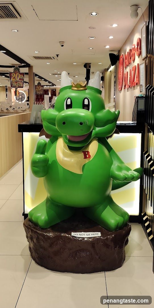 Dragon mascot at restaurant entrance