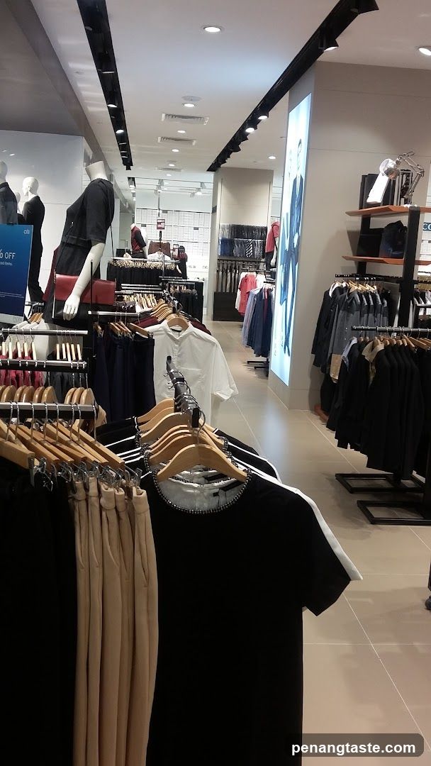Clothing store interior with mannequins and clothing racks