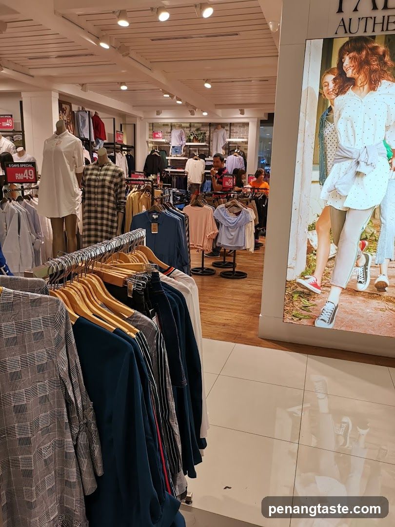 Clothing store interior with mannequins and sale signs